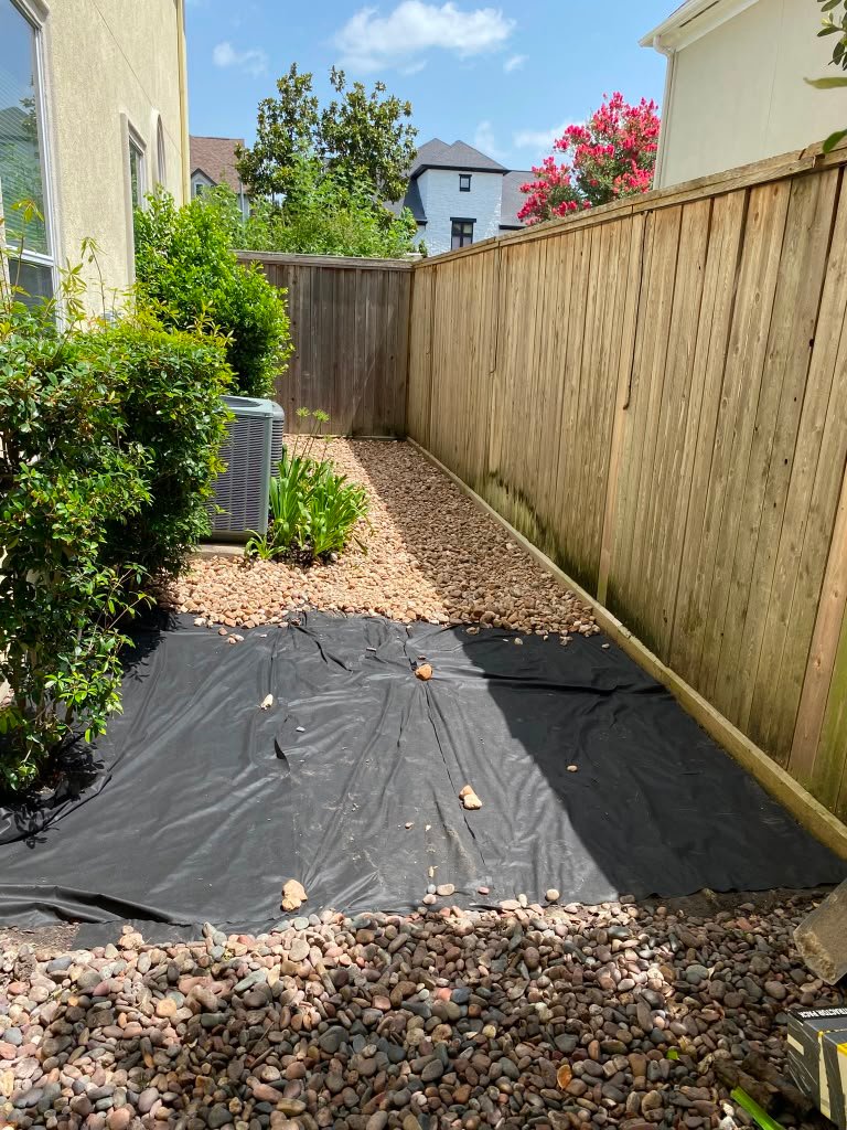 Residential landscape area finished with decorative stone